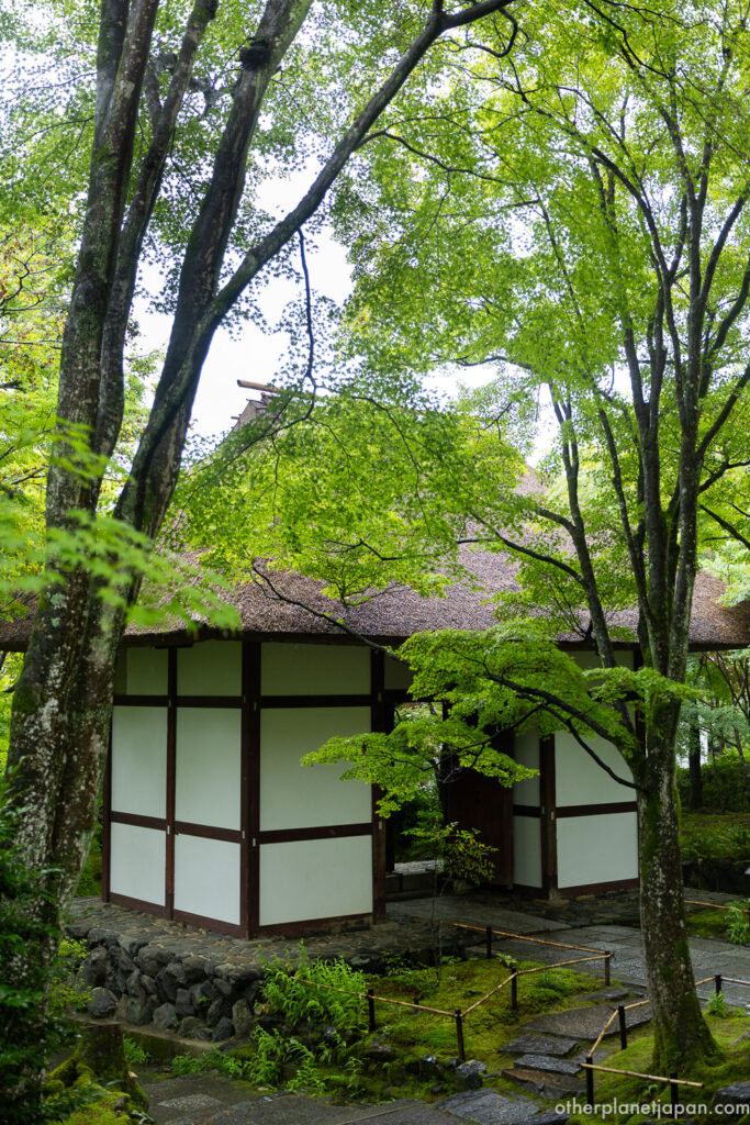 Traditional thatched temple building with white walls at Jojakkoji in summer, Arashiyama, Kyoto