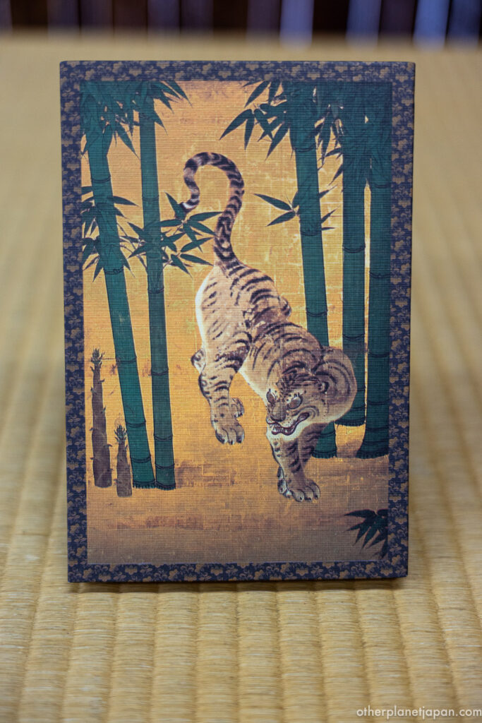 Nanzen-ji temple goshuin book with a gold-leaf tiger and bamboo design, Kyoto
