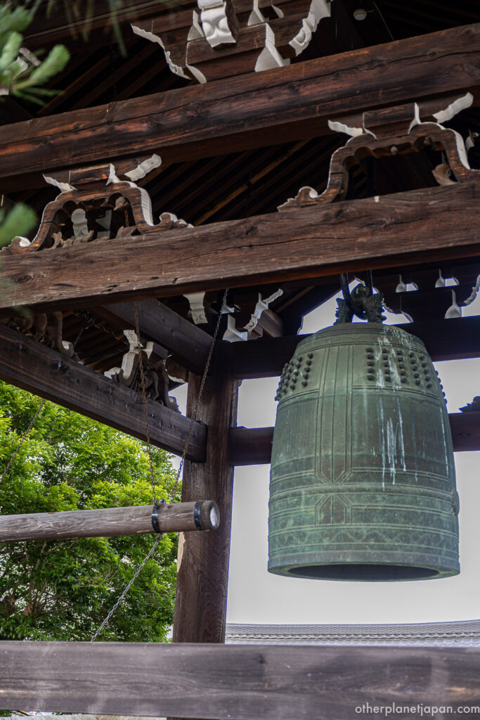 Bronze bonsho temple bell hanging in the wooden belfry at Konkai-komyoji (Kurodani), Kyoto