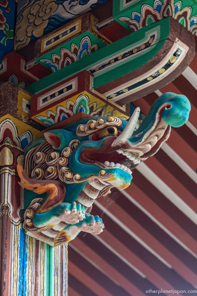 Colorfully painted wooden dragon carving on a pillar bracket at Eikando Temple, Kyoto