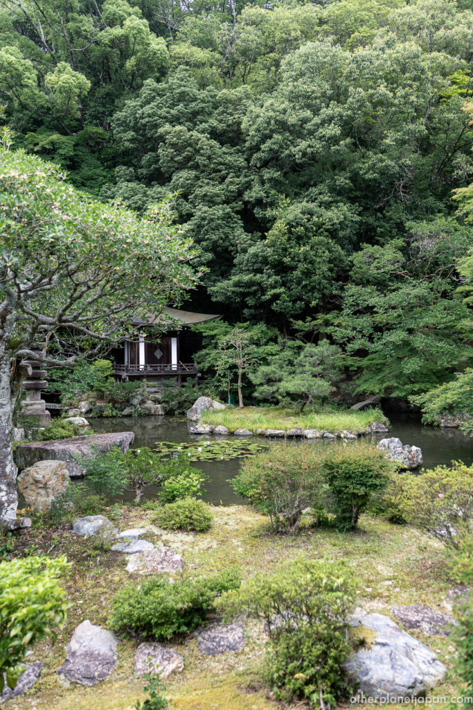 Green strolling garden and pond with a small shrine hall at Bishamondo Temple, Kyoto