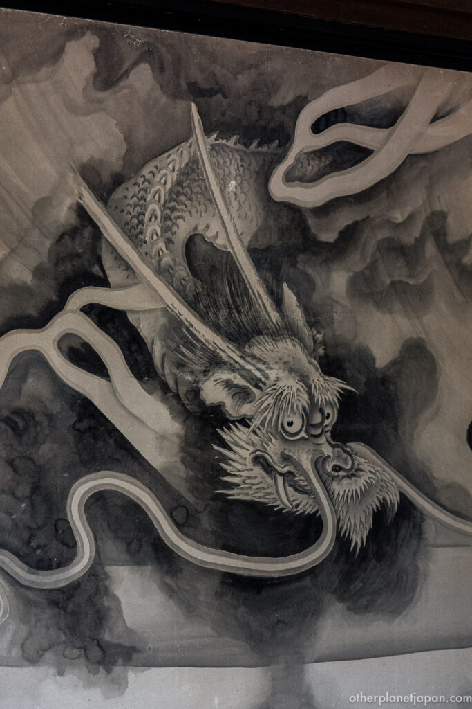 Traditional sumi-e ink painting of a dragon inside Ryoanji Temple