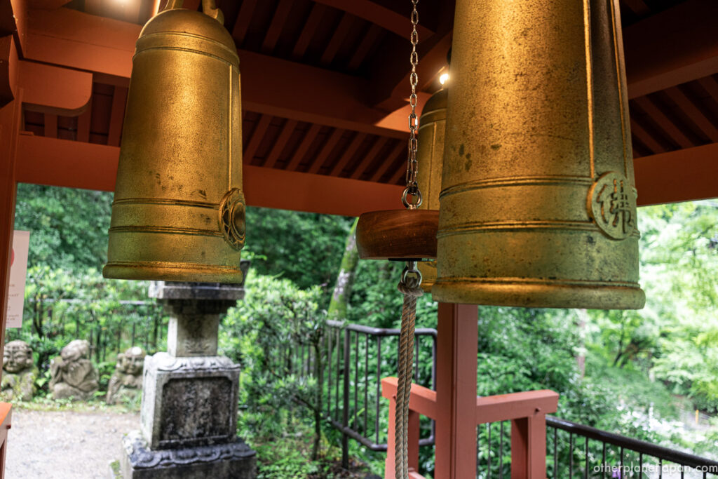 Three golden bells of the Sanpo no Kane bell tower at Otagi Nenbutsuji temple in Kyoto