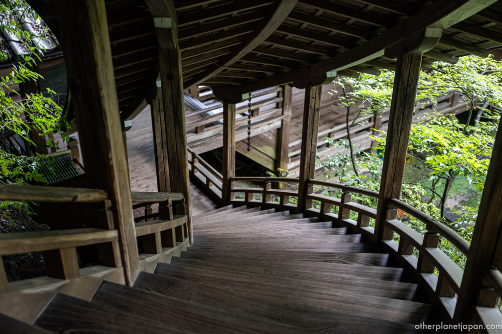 Long wooden corridor with polished dark floorboards and garden views at Eikando Temple, Kyoto