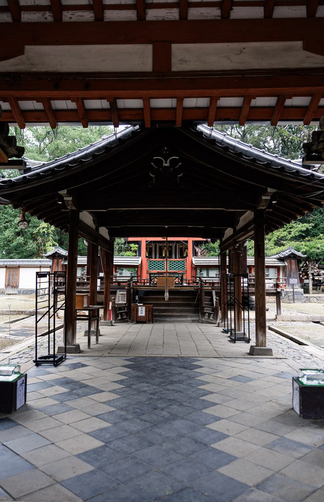 The vermilion main sanctuary of Himuro Shrine seen through the worship hall
