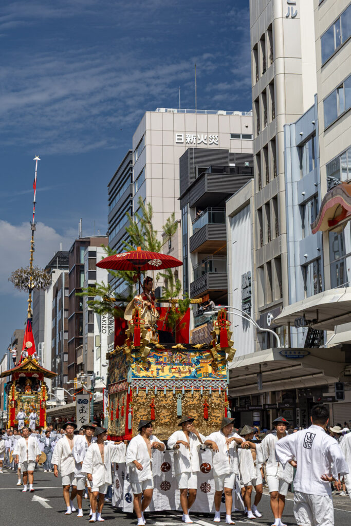 Gion Matsuri yamaboko floats moving along Shijo Street in Kyoto